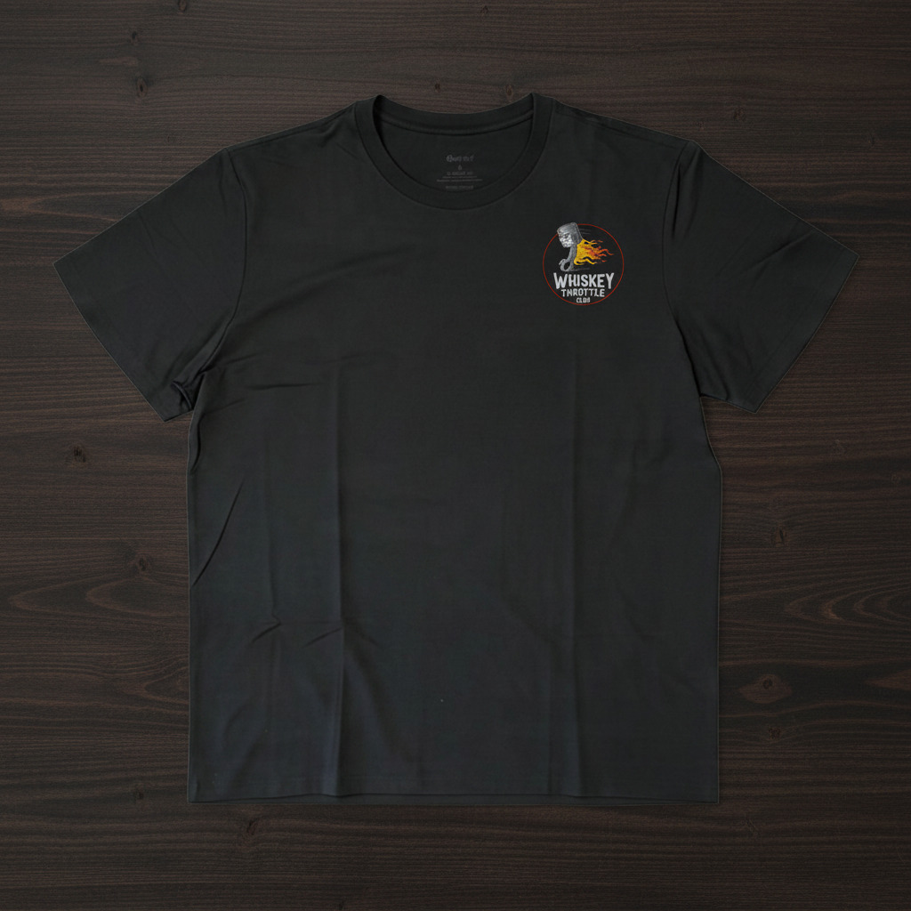 A black short-sleeve crewneck t-shirt with a small graphic on the left chest featuring a portrait of Jim Beam and the text 'Whiskey Distilled'.