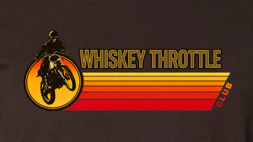A dark brown short-sleeve crewneck t-shirt featuring a retro-style chest graphic with a dirt bike rider, the text 'WHISKEY THROTTLE' in yellow, and horizontal red, orange, and yellow stripes.