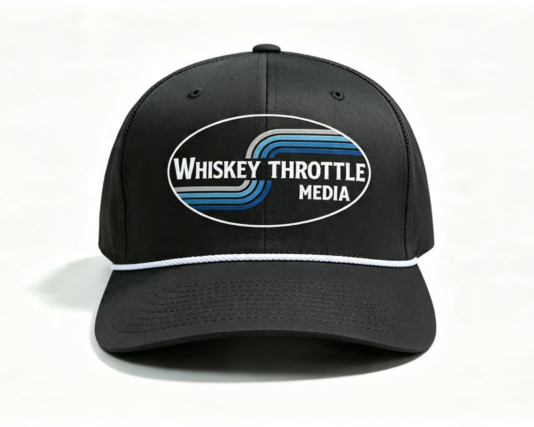 A black baseball cap with a white embroidered logo on the front that reads 'Whiskey Throttle Media' inside an oval with blue and white stripes, shown on a plain white background.